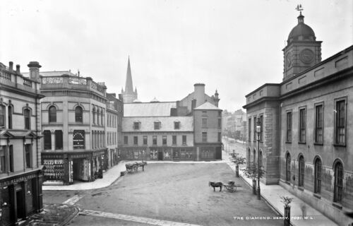 View of The Diamond looking towards Bishops Street in the late 19th Century showing the former ‘Austins & Co’ drapery store on the left and the former Town Hall on the right; both destroyed in a severe fire in 1903. 

Photo taken by Robert French sometime between 1865 and 1903.

(Image reproduced courtesy of the National Library of Ireland).